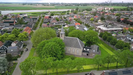 The-village-church-of-Nieuw-Beijerland-in-the-Netherlands,-founded-in-1826,-side-and-rear-view