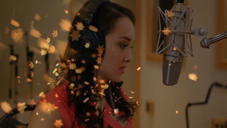woman recording vocals into condenser microphone in music studio, showcasing golden star effects