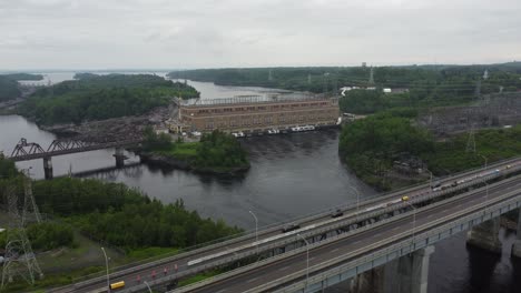 Dam-with-bridge,-cloudy-summer