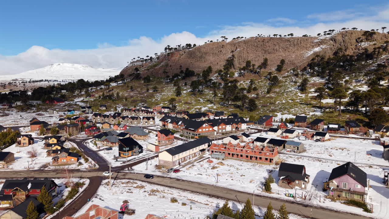 Picturesque Patagonian village of Caviahue framed by snow and rocky mountains, Neuquén, Argentina