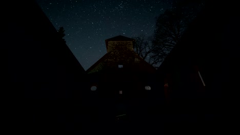 starry night over historic church ruin time lapse