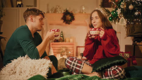 woman talking with male friend while having coffee