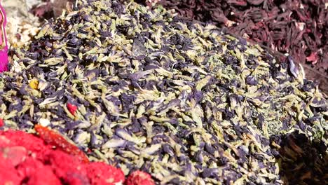 dried butterfly pea flowers at a spice market