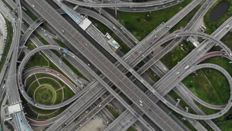 high angle looking top down view of complicate road and expressway intersection in bangkok city of thailand. shot by drone can use for transportation or abstract concept.