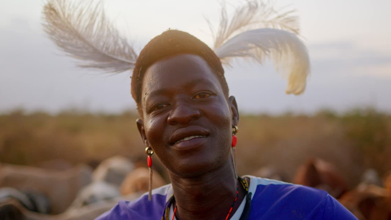 Traditional African Warrior Wearing a Hat Adorned With an Ostrich Feather in Uganda, Africa - Close Up