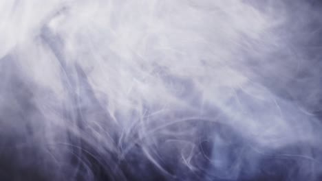 Video-of-white-clouds-of-smoke-moving-with-copy-space-on-black-background