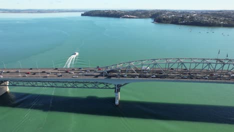 Vehicles-Traveling-In-Auckland-Harbor-Bridge-In-New-Zealand---Aerial-Drone-Shot