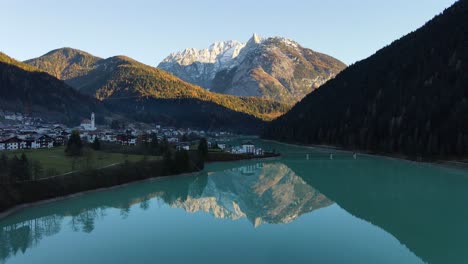 amazing mountains reflected in the lake with sunset