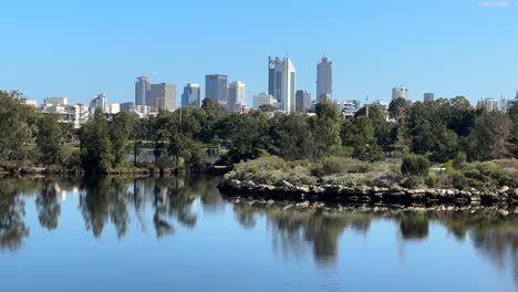 Cityscape-of-Perth,-Western-Australia-across-lake-at-Burswood