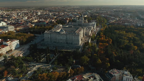 Aerial-panoramic-footage-of-large-city.-Amazing-shot-of-Royal-Palace-and-Almudena-Cathedral-at-golden-hour.