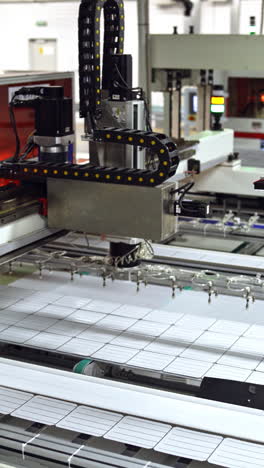 modern automated solar energy production. working factory mechanism of making solar cells. innovation technology concept. vertical video