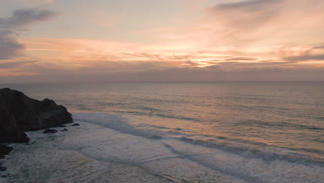 Pacific-Ocean-Waves-Crashing-Into-Cliffs-Below-Northern-California-Sunset-4K-Aerial-Imagery