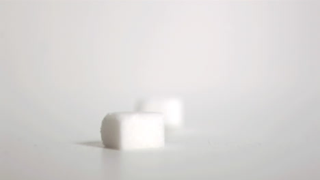 sugar cubes falling down in super slow motion