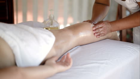 woman getting massage treatment in beautiful spa