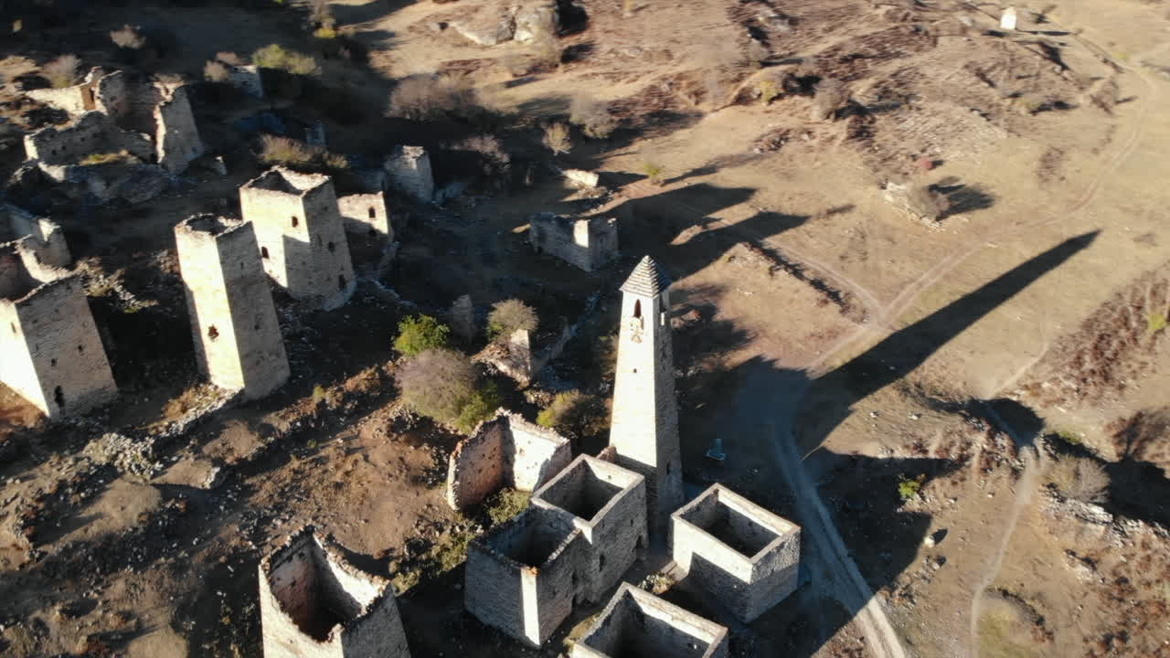 Ancient Stone Ruins and Tower in a Historical Village
