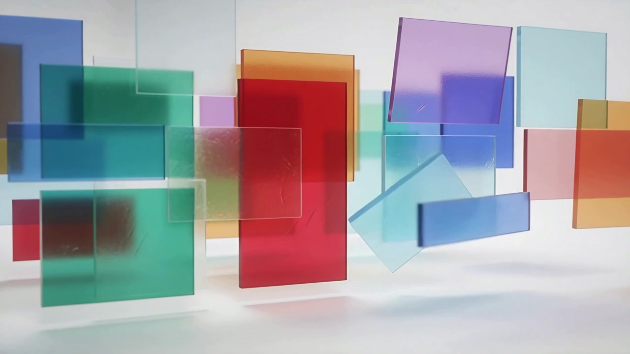 Movimento iniziale di pannelli colorati che si spostano, scorrendo e ruotando in studio, rivelando una forma a goccia e cavi.