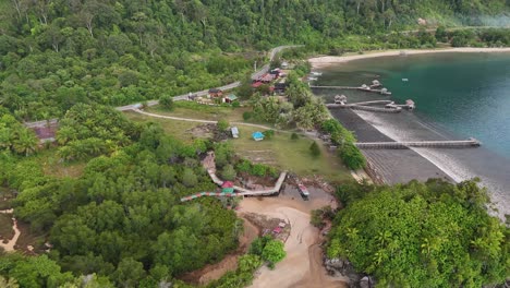 drone aerial view of indonesian coastline padang west sumatra tropical ocean rainforest jungle trees