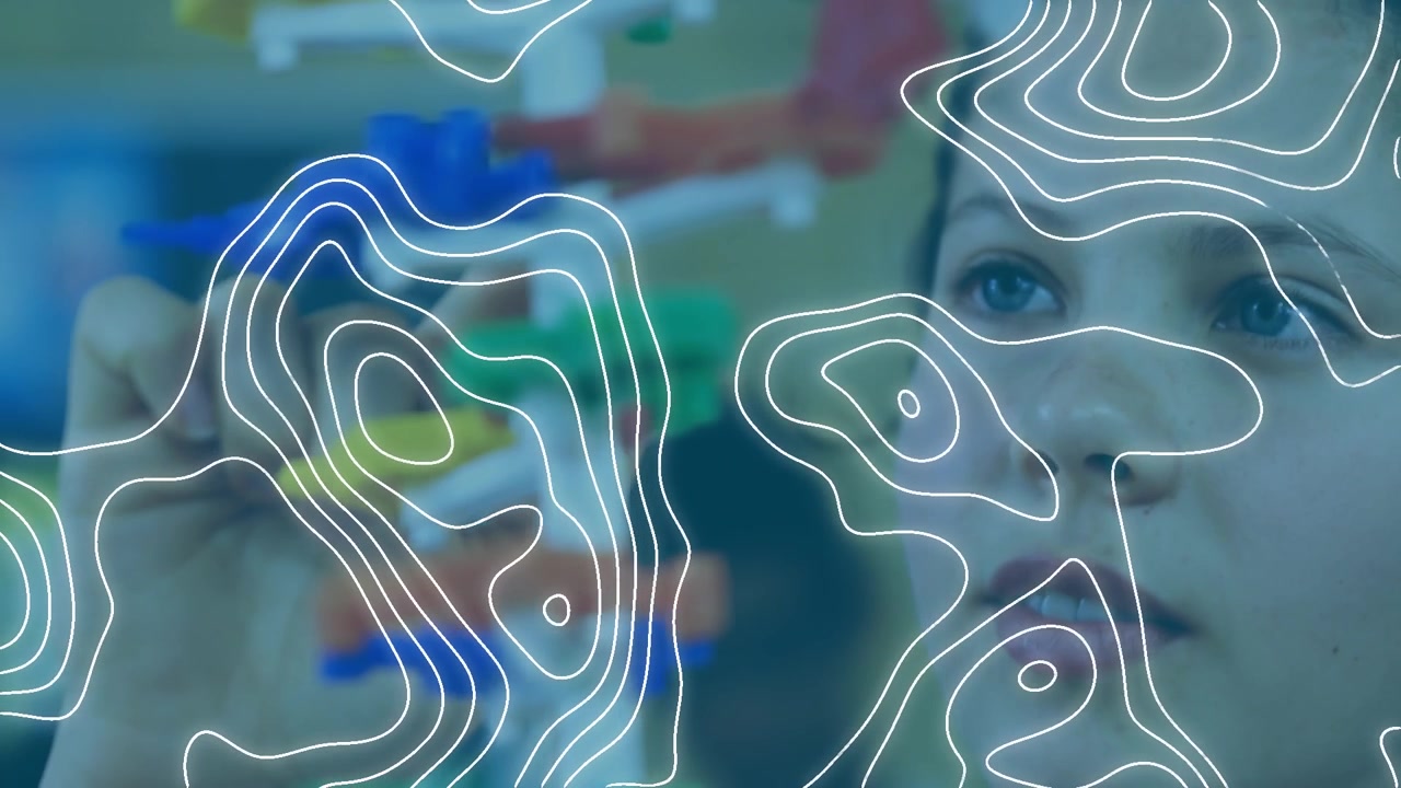Animation of moving shapes over caucasian schoolgirl with model