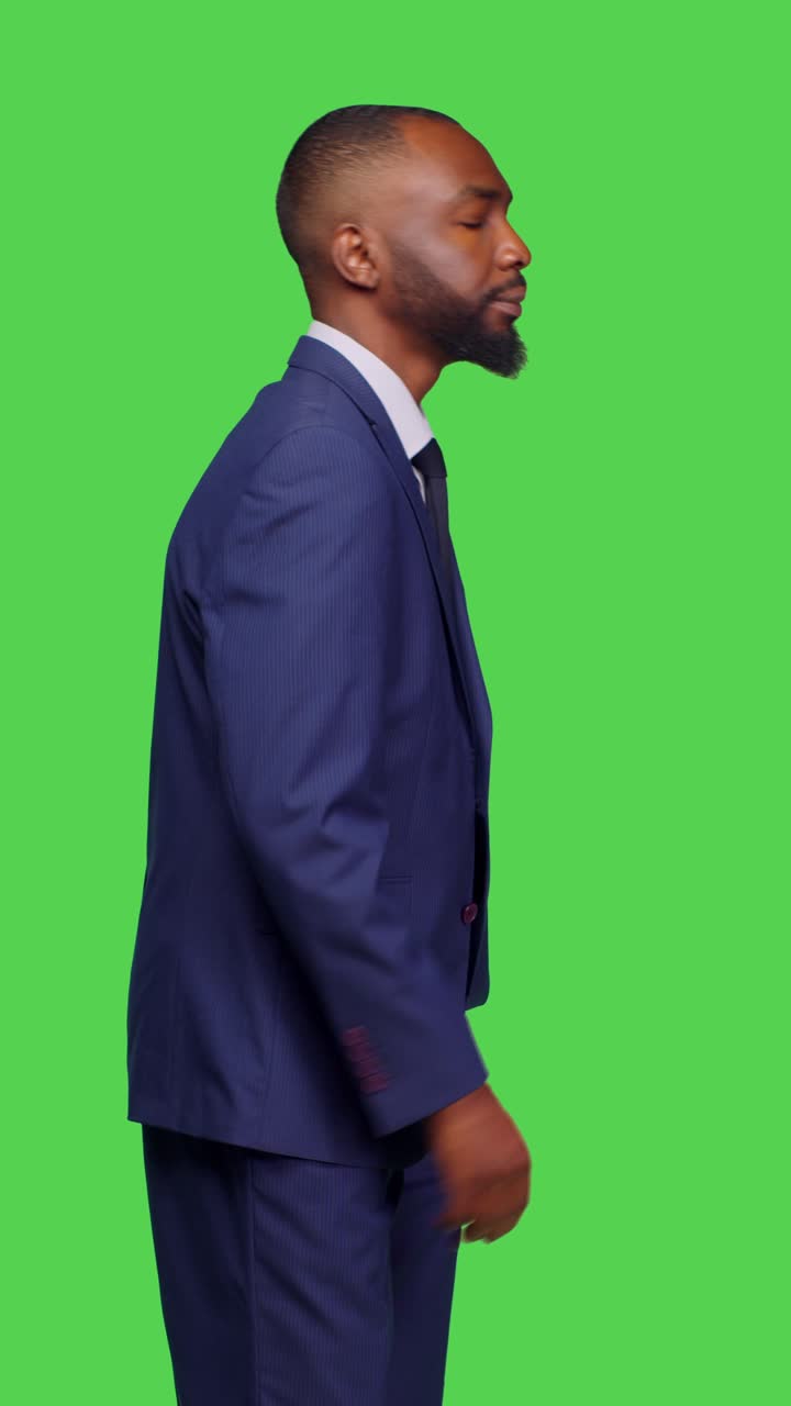 Vertical video: Profile of african american office worker feeling confident on camera