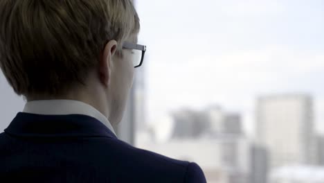 businessman looking out window