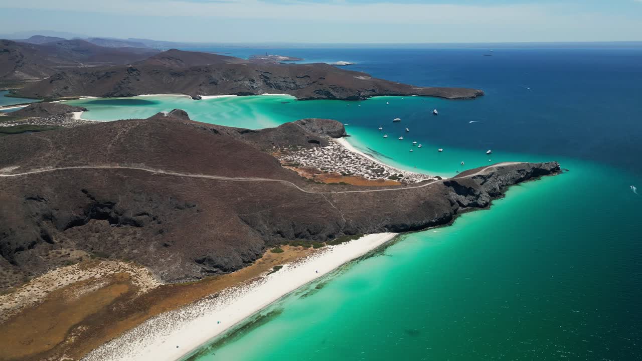 Tecolandra beach, la paz, showcasing pristine turquoise waters and desert hills, aerial view
