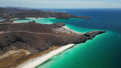 tecolandra beach, la paz, showcasing pristine turquoise waters and desert hills, aerial view