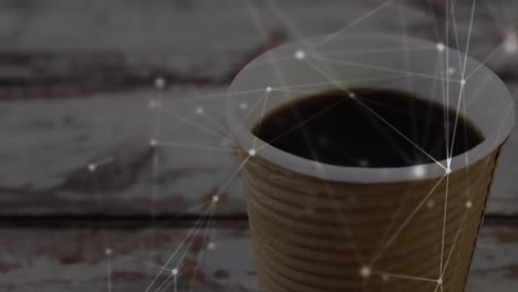 Animation-of-network-of-connections-over-cup-of-coffee