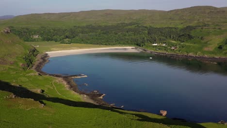 aerial footage showing calgary beach and bay on the isle of mull in scotland on a sunny evening