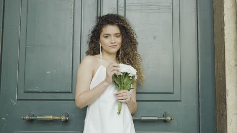 woman in white dress with flowers