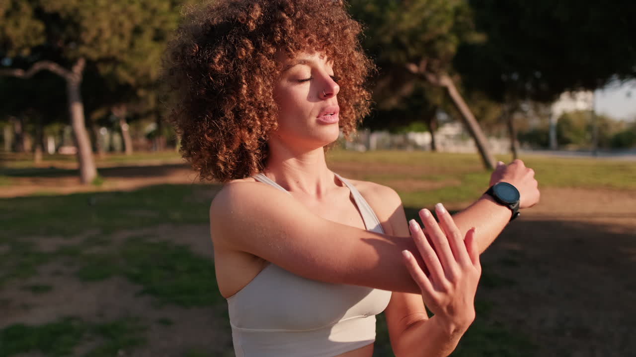 Woman Stretching in the Park