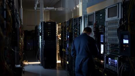 technician working on server racks in a data center