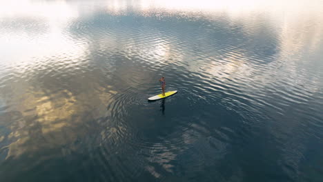 Woman-Standup-Paddleboarding-On-Lake-At-Sunrise-On-Moso-Island,-Vanuatu