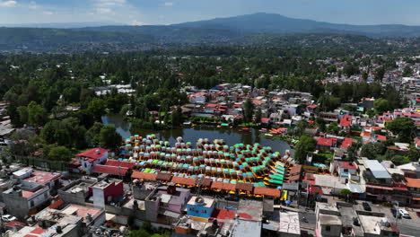 aerial view of xochimilco canals and colorful trajineras in mexico city