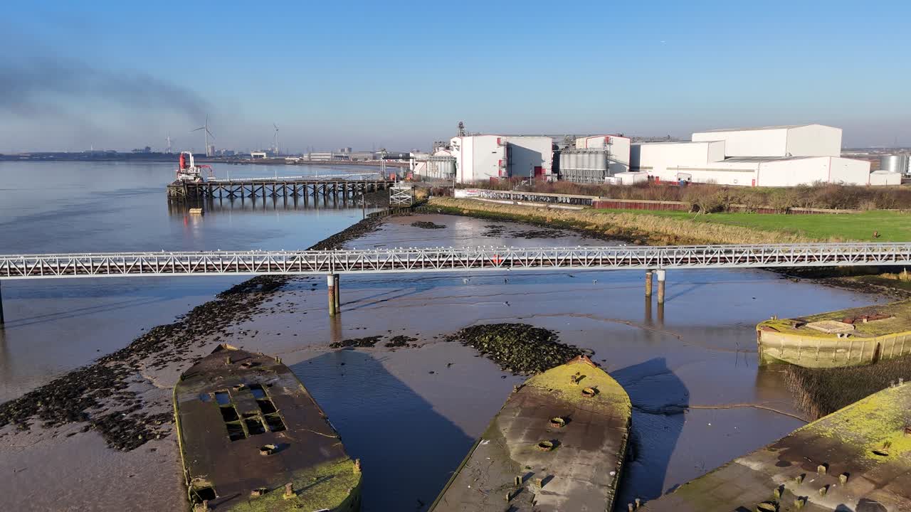Abandoned Concrete Barges river Thames UK pull back drone reverse reveal