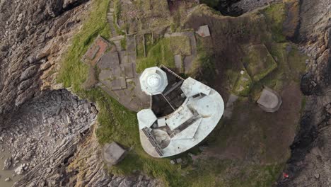 top view of mumbles lighthouse during daytime in united kingdom. drone shot.
