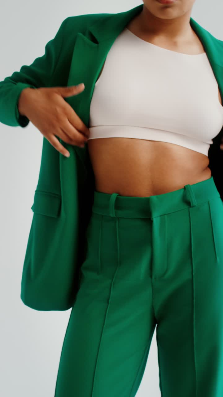 Woman in Green Suit and Crop Top