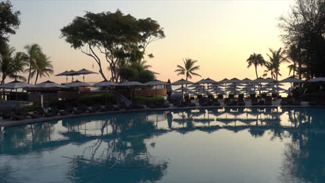 bed pool with umbrella around swimming pool in hotel resort for vacation concept-3