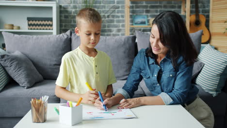 mother and son drawing together