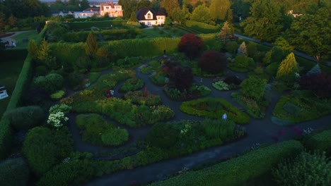 gorgeous house with a large stunning garden with the morning sunlight beaming onto the house