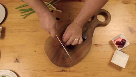 hands, chopping, beets, dinner table, wooden table, top view, close-up, food, cooking, kitchen, preparation, ingredients, beetroot, healthy, breakfast, lunch, dinner, snack, vegetarian, vegan