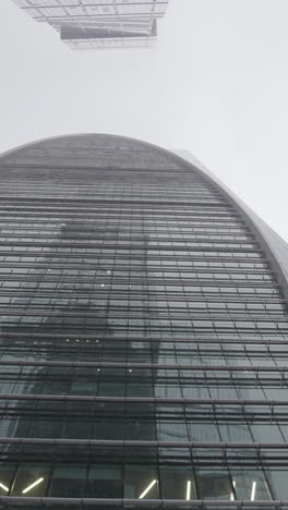 modern skyscraper in foggy weather