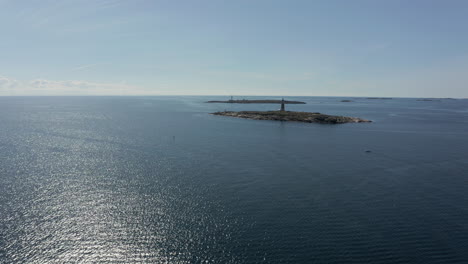 Aerial,-Lille-and-Store-Torungen-Islands-Lighthouses-in-Shimmering-Norway-Sea