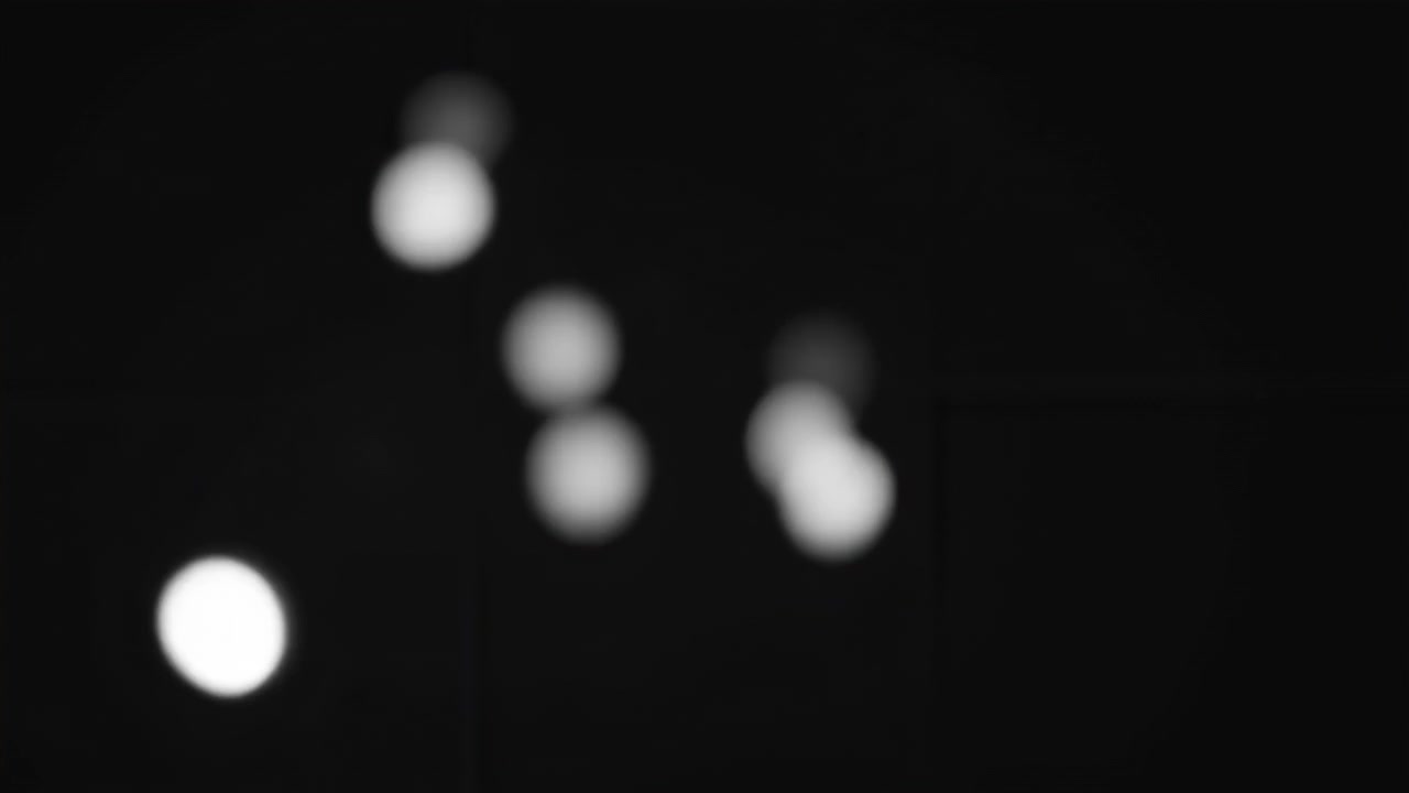 Floating White Bokeh Orbs On Black Background, Soft Glowing Blur Dots Drifting In Cinematic Motion, Subtle