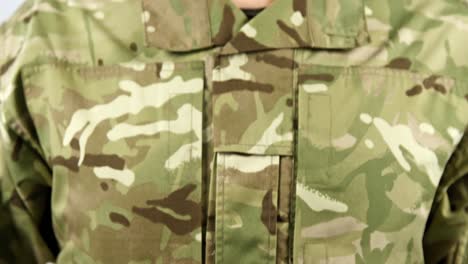 close-up of soldier holding dairy on white background