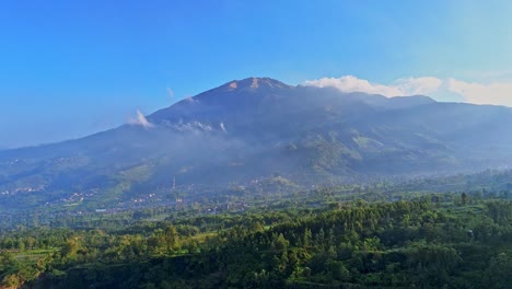 aerial view rural landscape of merbabu mountain in misty morning. indonesia nature countryside. 4k drone footage.