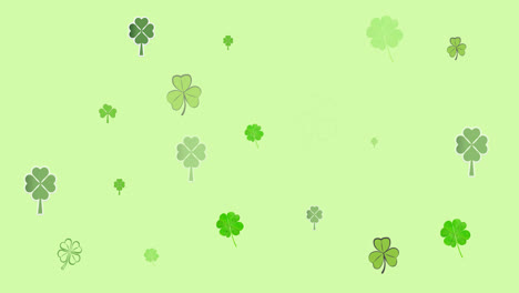 Digital-animation-of-multiple-clover-leaves-forming-against-green-background