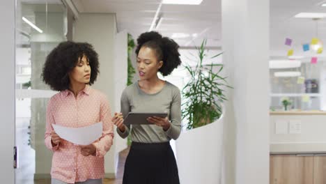 Diverse-business-people-discussing-work-at-office,-slow-motion