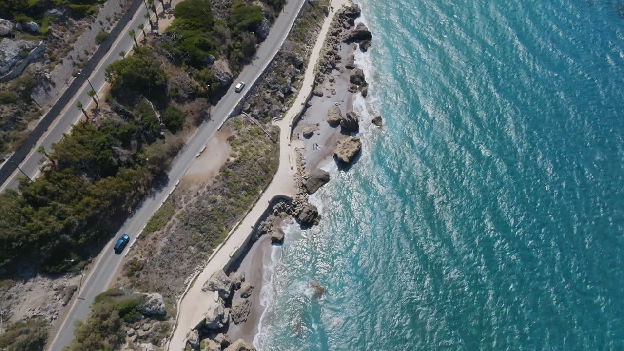 Aerial view overlooking traffic on the coastline of Rhodes, sunny day in Greece