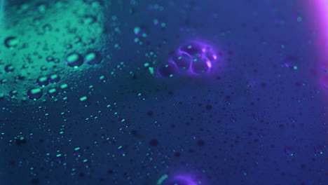 Bubbles-with-neon-colors-disappearing-Fast,-Close-up