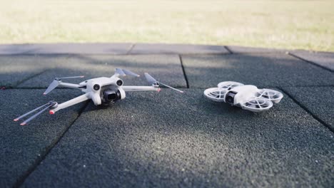 two drones lying on the ground